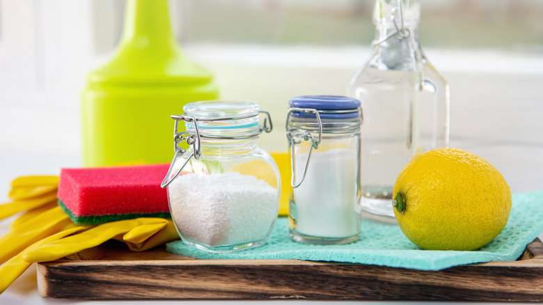 Cleaning supplies on kitchen table.
