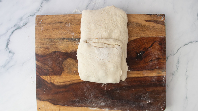 Dough rectangle with bottom portion folded over middle