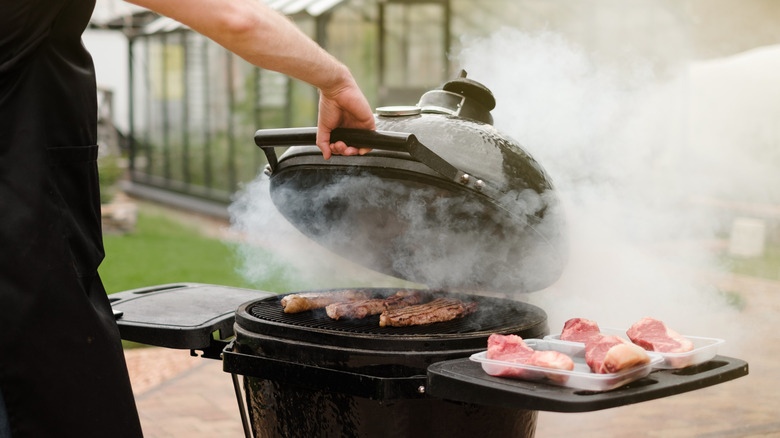 Smoking grill with steak