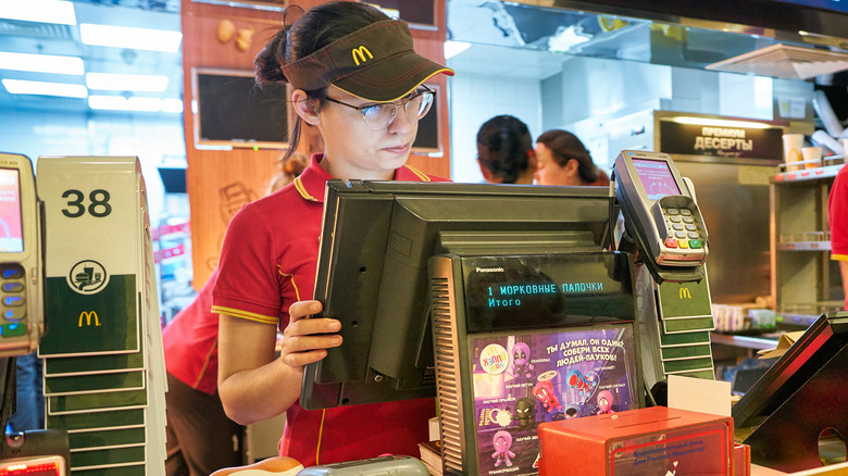 McDonald's worker using computer checkout