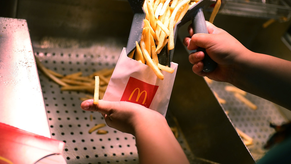 McDonald's employee bags up fries