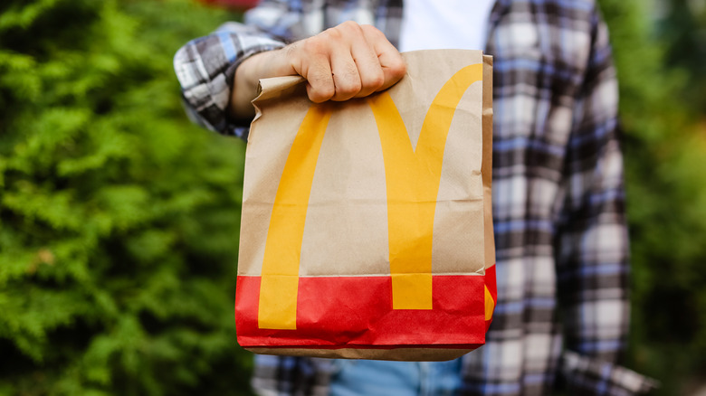 Man holding McDonald's bag