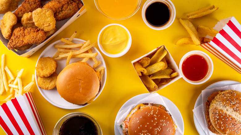 Assortment of fast food items spread out on a table