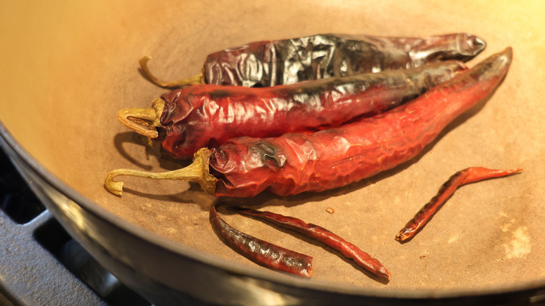 dried chiles toasting in a large pot