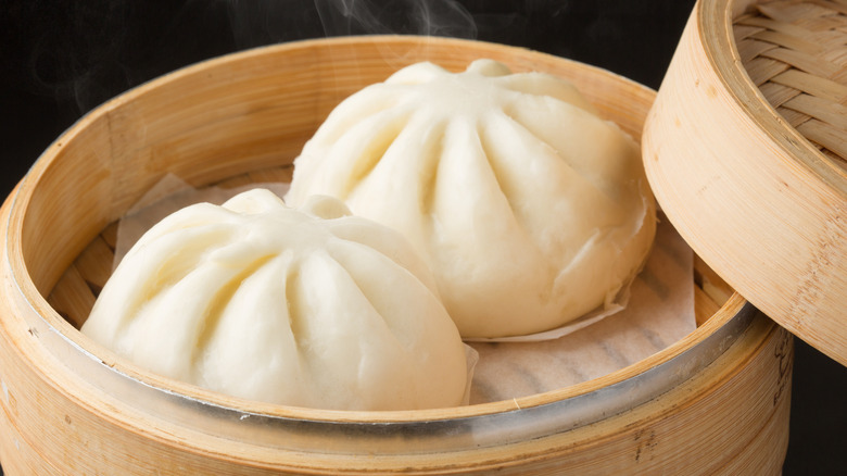 white bao buns in steamer