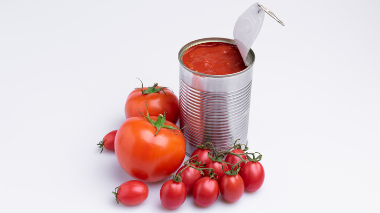 Canned tomatoes on shelves 