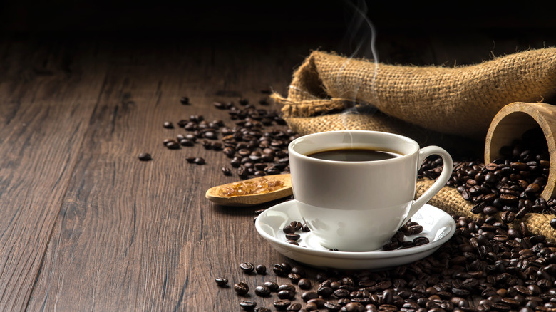 Cup of coffee and coffee beans