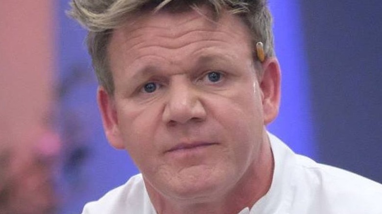 Gordon Ramsay in Hell's Kitchen with a pencil tucked behind his ear