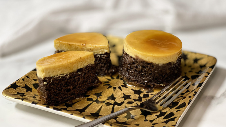 Mini chocoflan cakes on plate with fork