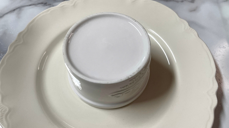 Upside-down ramekin on plate