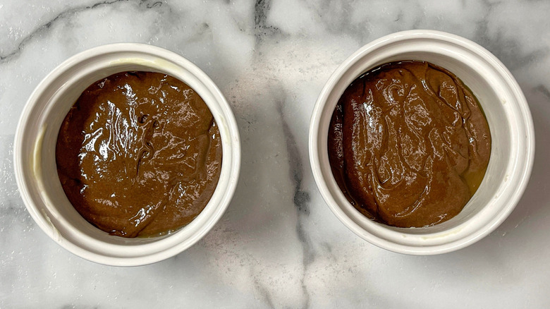 Ramekins filled with chocolate cake batter