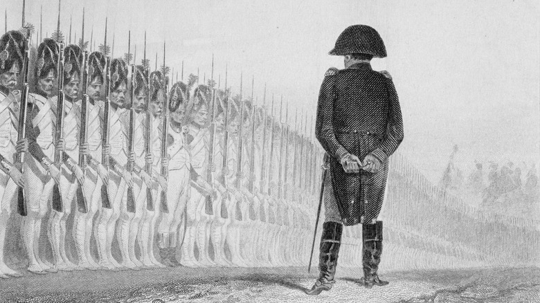 Napoleon Bonaparte reviews his troops.