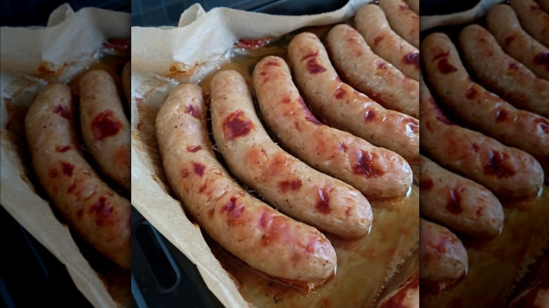 Baked bratwurst on a sheet pan