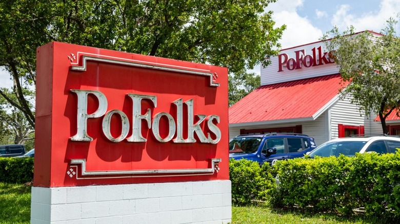 Exterior and red sign of PoFolks in St. Petersburg, Florida