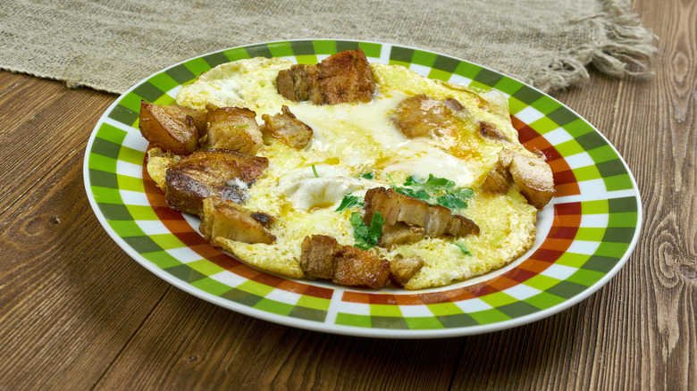 Plate of Hangtown fry on rustic table
