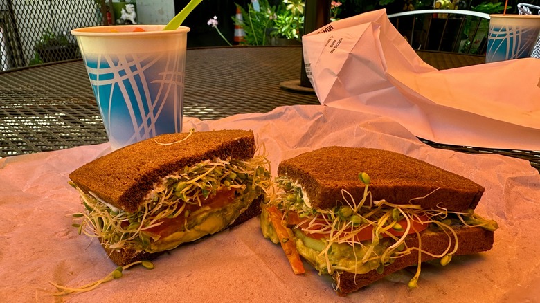 Sandwich and drink on outdoor table at Brighter Side in Modesto, California.