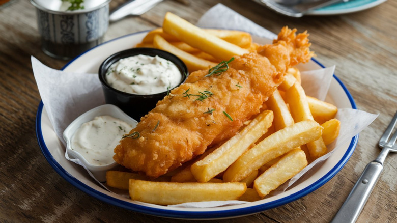 fried fish, fries and tartar sauce on a plate