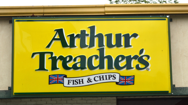 Yellow Arthur Treacher's sign on storefront