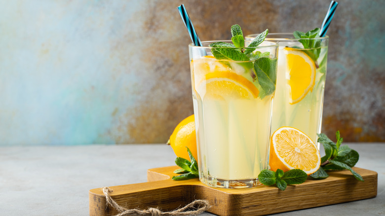 Two glasses of lemonade with straws