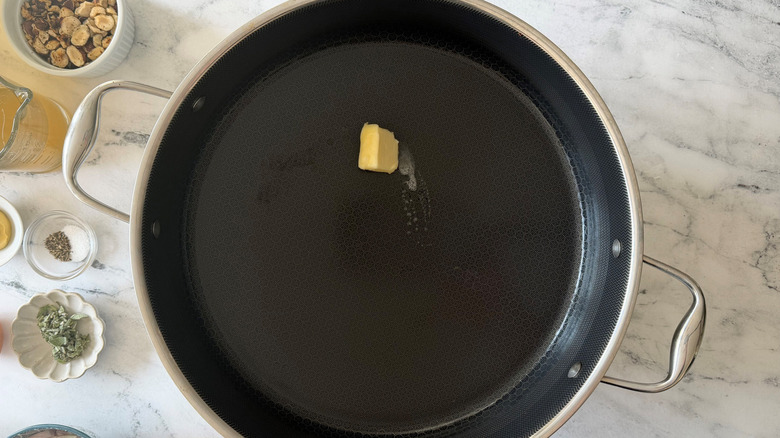 Pat of butter melting in skillet