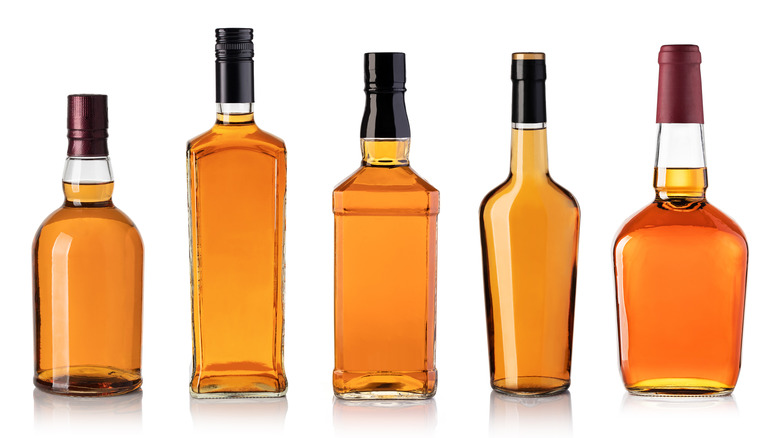 Bottles of bourbon/whiskey with no labels