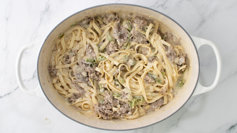 pasta with creamy cheese sauce and shaved steak