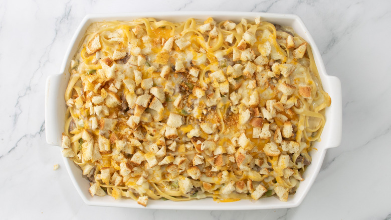 cheesy baked pasta dish topped with bread chunks