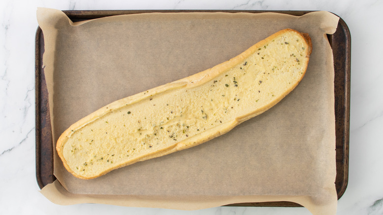 garlic bread on baking sheet