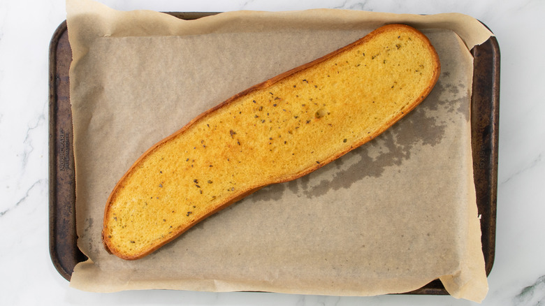 toasted garlic bread on baking sheet