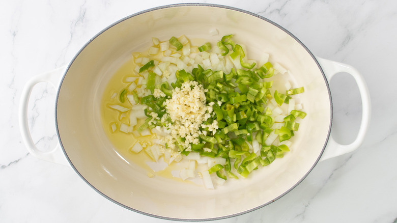 diced onion, garlic, and hot pepper in dutch oven