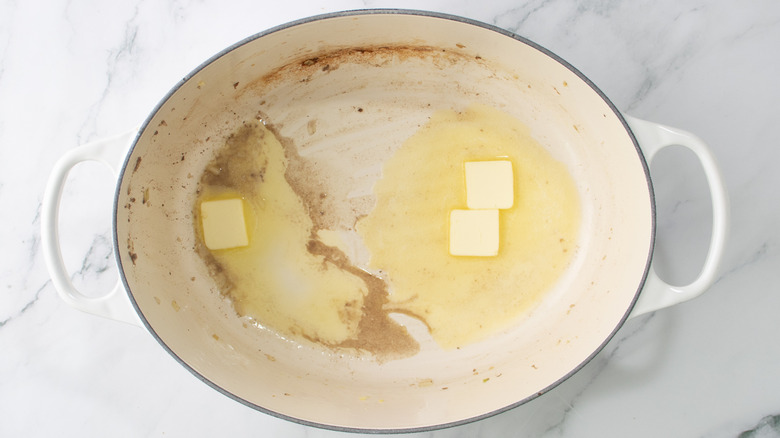 butter cubes melting in dutch oven