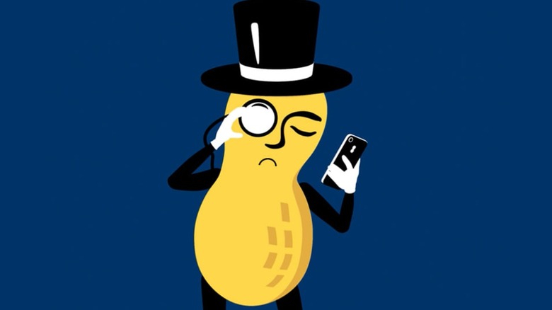 Mr. Peanut looking at cell phone