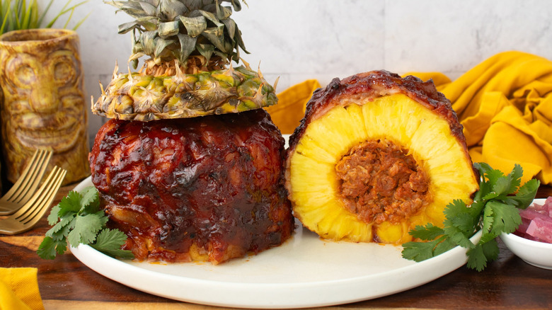 Pork-stuffed pineapple halves on plate