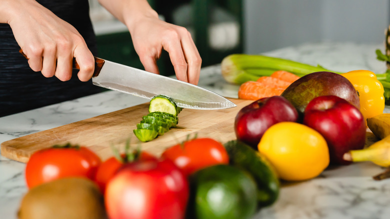 cutting raw cucumber