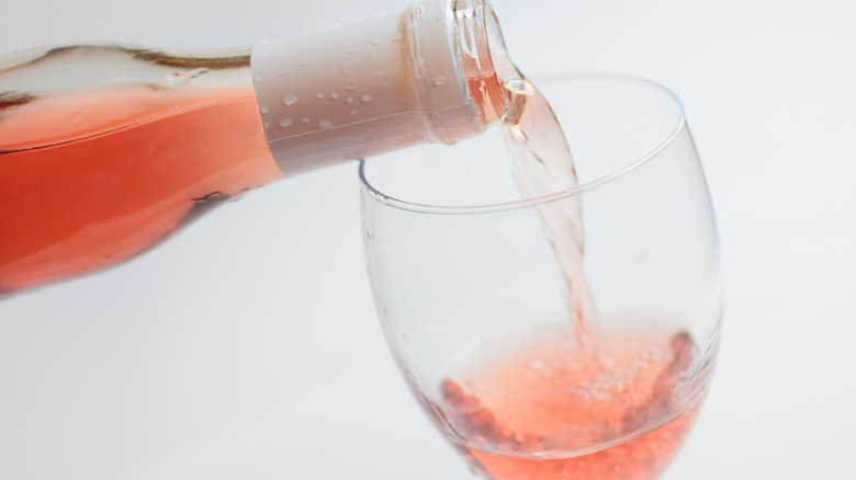 Rosé being poured into glass 