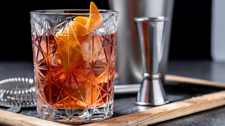 Glass of bourbon with orange twist