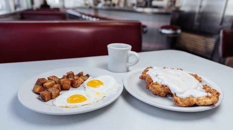 Interior of Oasis Diner with breakfast foods on table