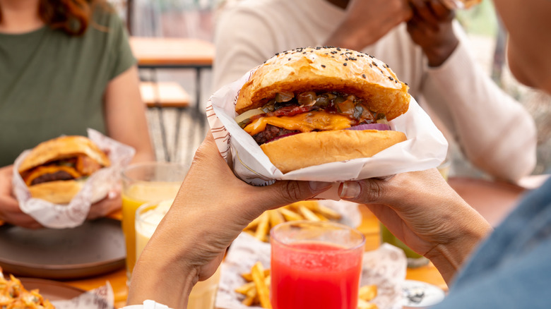 People eating burgers and fries