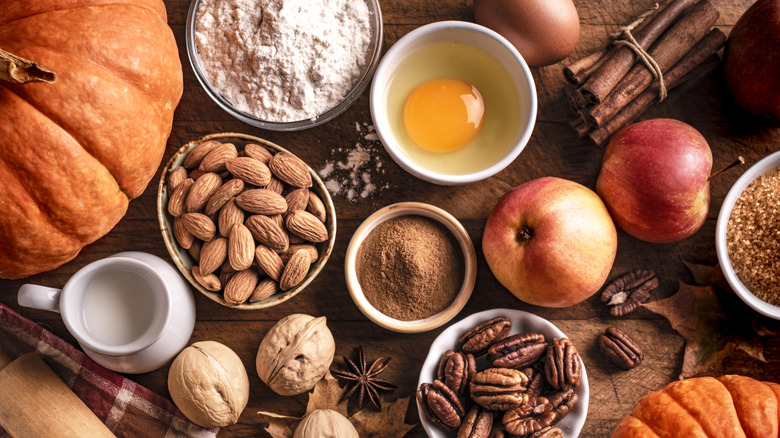 Autumnal baking ingredients on wooden table