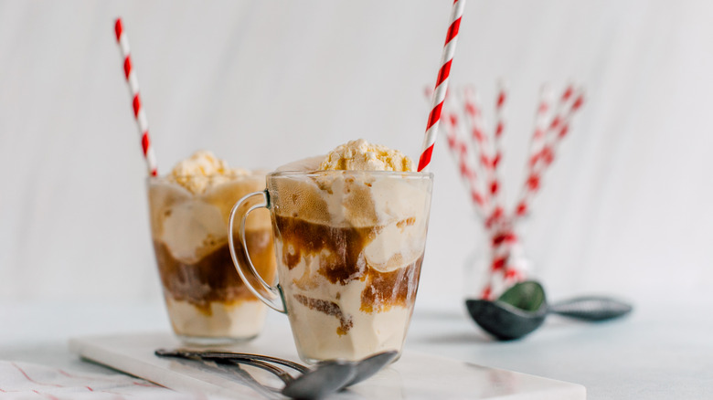 Root beer floats with red and white straws