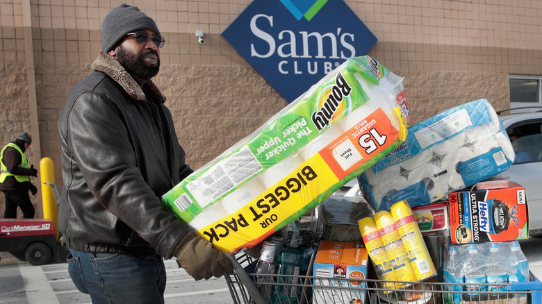 Sam's Club shopper with a cart of groceries