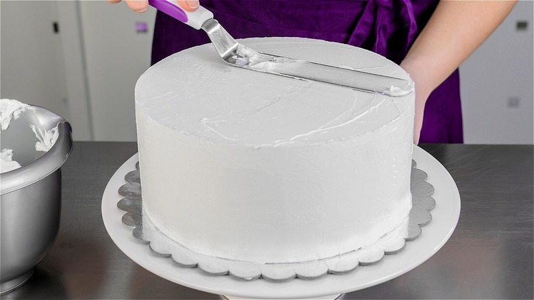 cake being iced