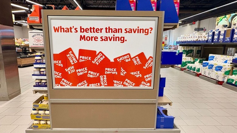 Signage inside Aldi store advertising the grocer's savings.