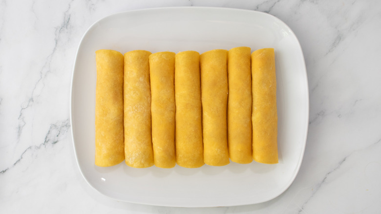 platter with rolled stuffed tortillas