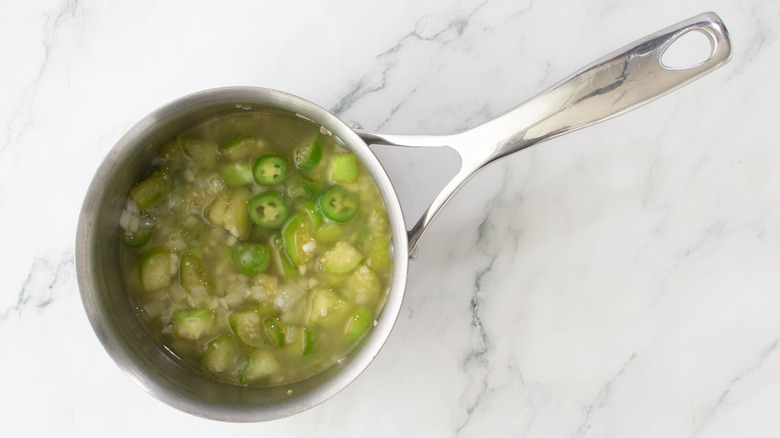 vegetables simmering with broth in saucepan