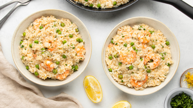 Two bowls of seafood risotto al limone