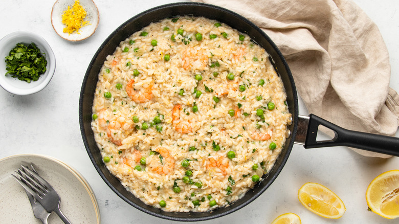 Seafood risotto al limone in frying pan