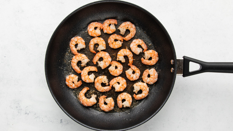 Shrimp cooking in frying pan