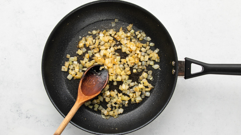 Onion sauteing in frying pan