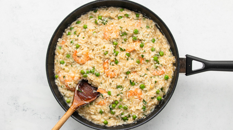 Seafood risotto al limone in frying pan